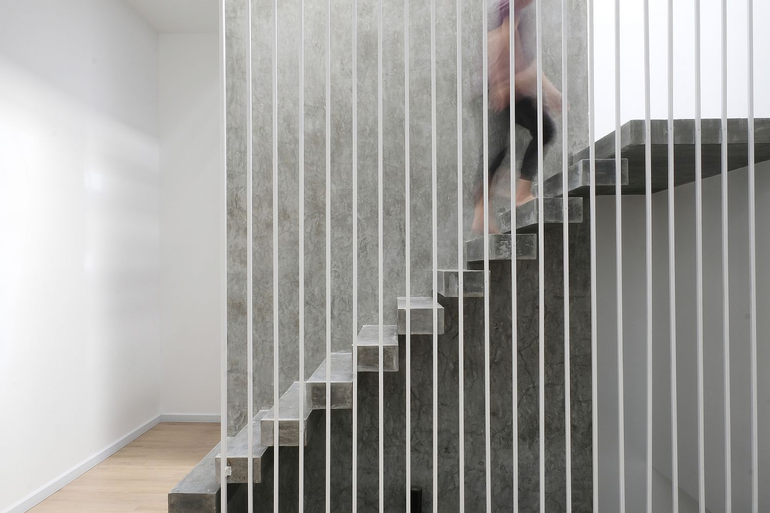 Stunning raw concrete staircase inside the house steals the show