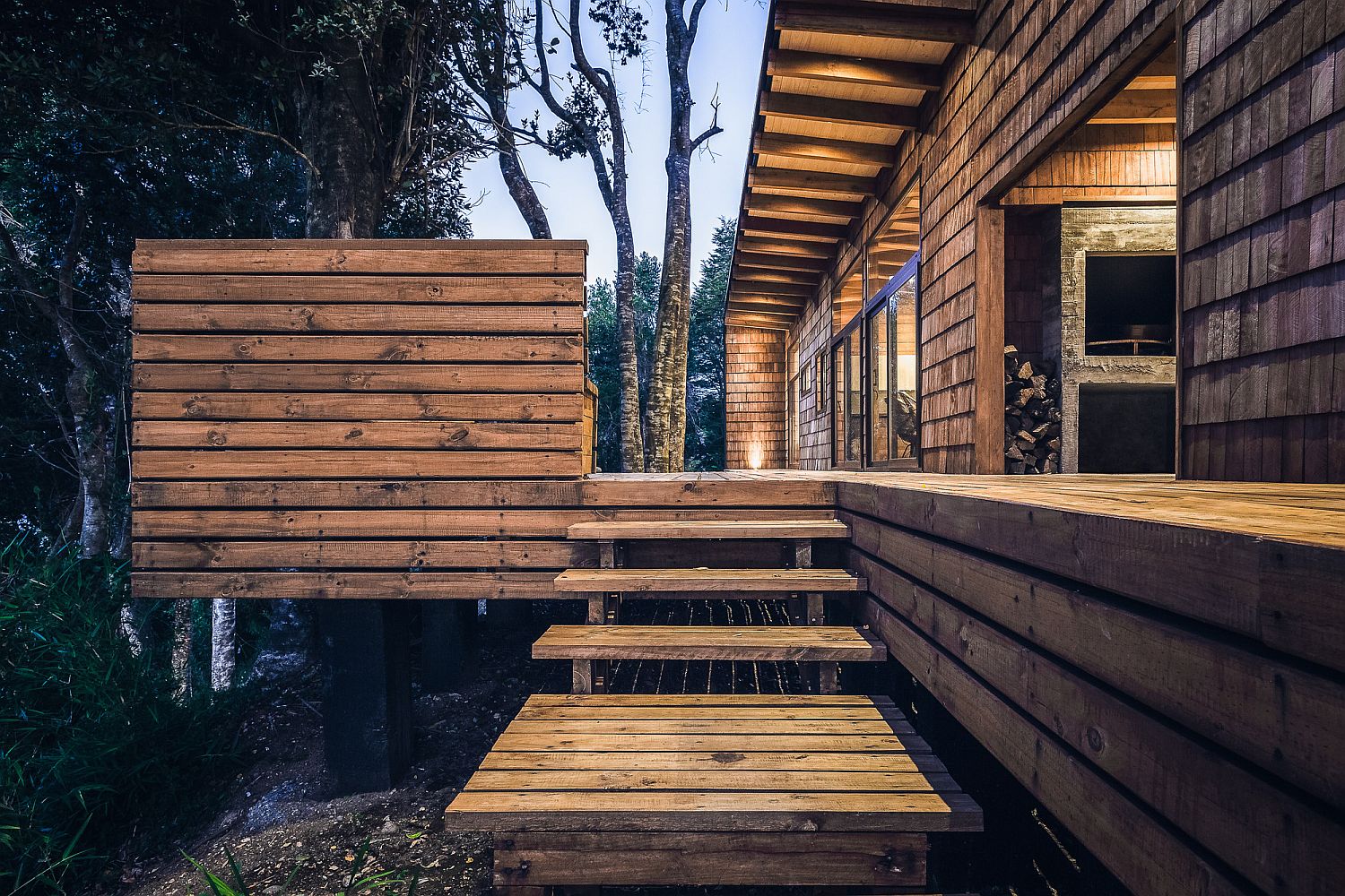Wooden-steps-leading-to-the-extensive-deck-around-the-home