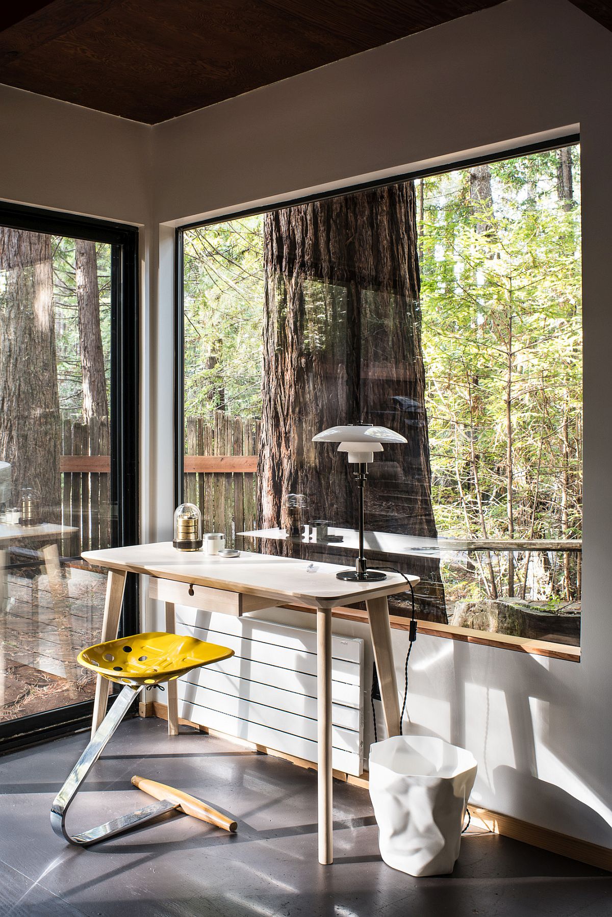 Beautiful work area of the cabin with forest view outside