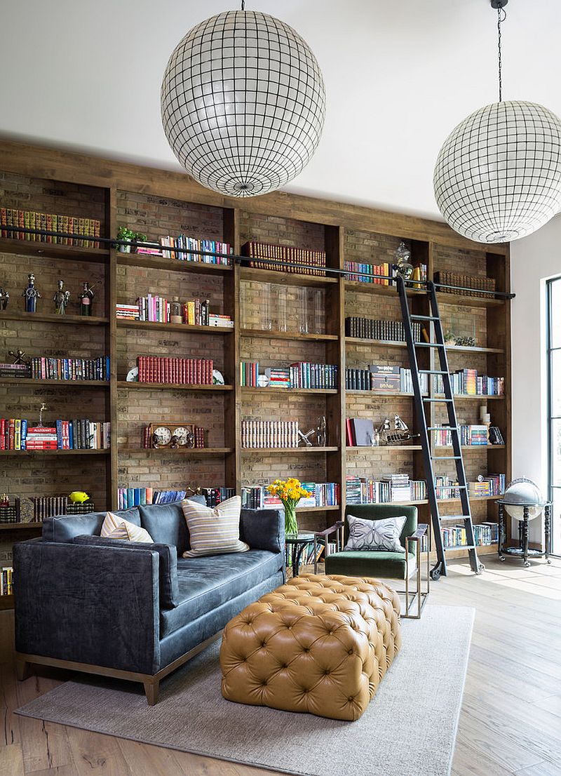 Brick wall in the backdrop adds beauty to the open shelves in wood inside the home office