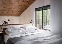 Cozy-and-space-savvy-bedroom-in-wood-and-white-217x155