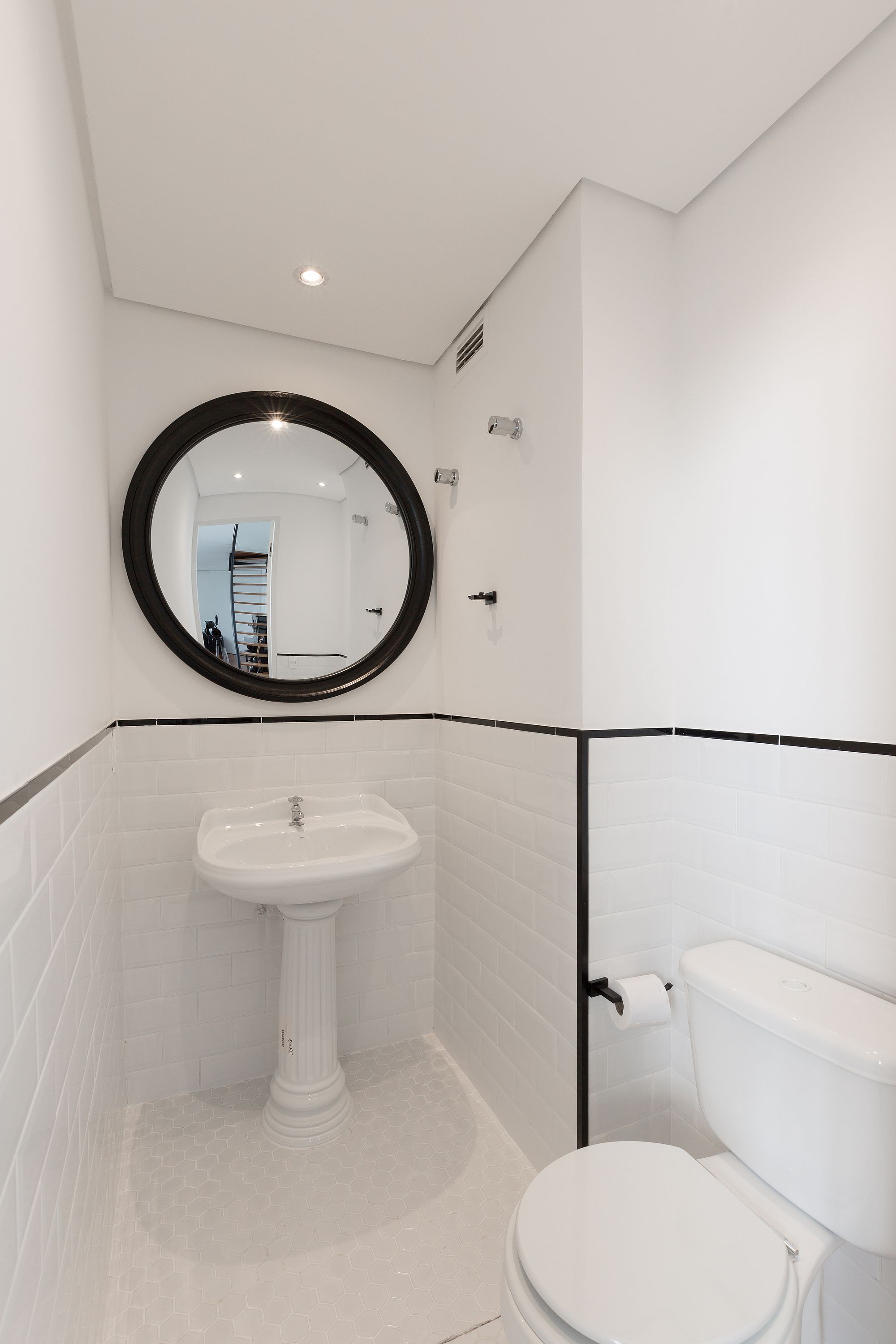 Dark-framed-mirror-and-retro-sink-for-the-tiny-toilet