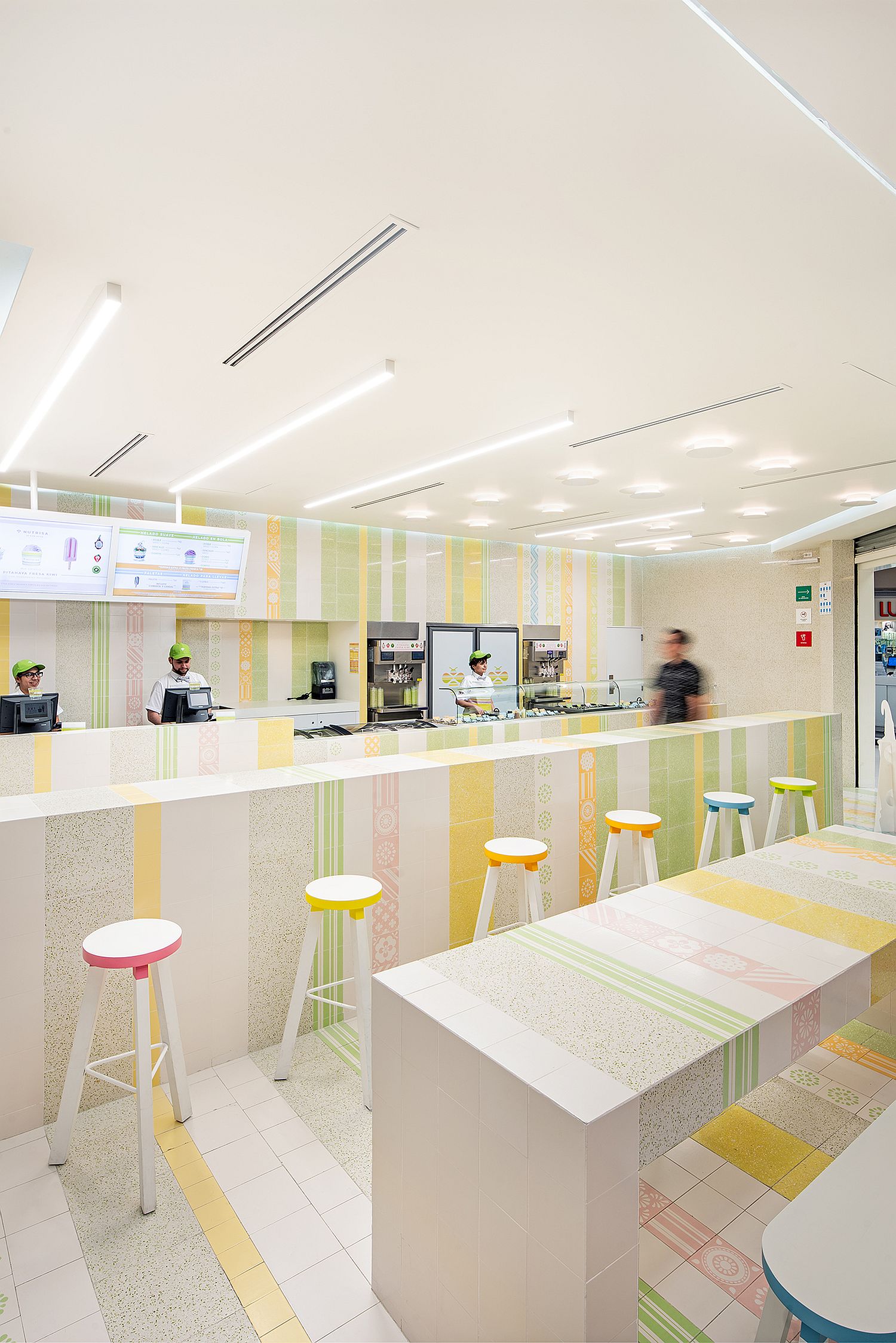 Even the bar stools bring pops of color to the interior