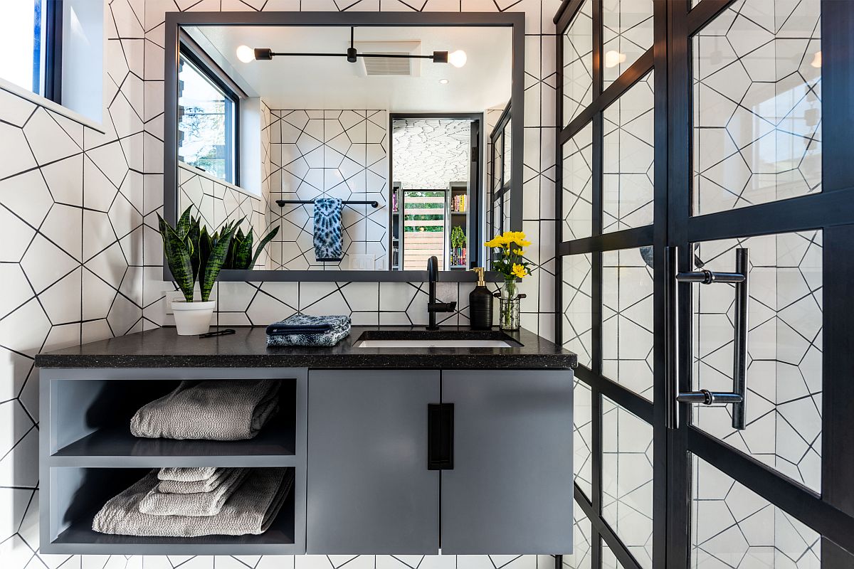 Geometric wall covering and floating vanity for the modest bathroom