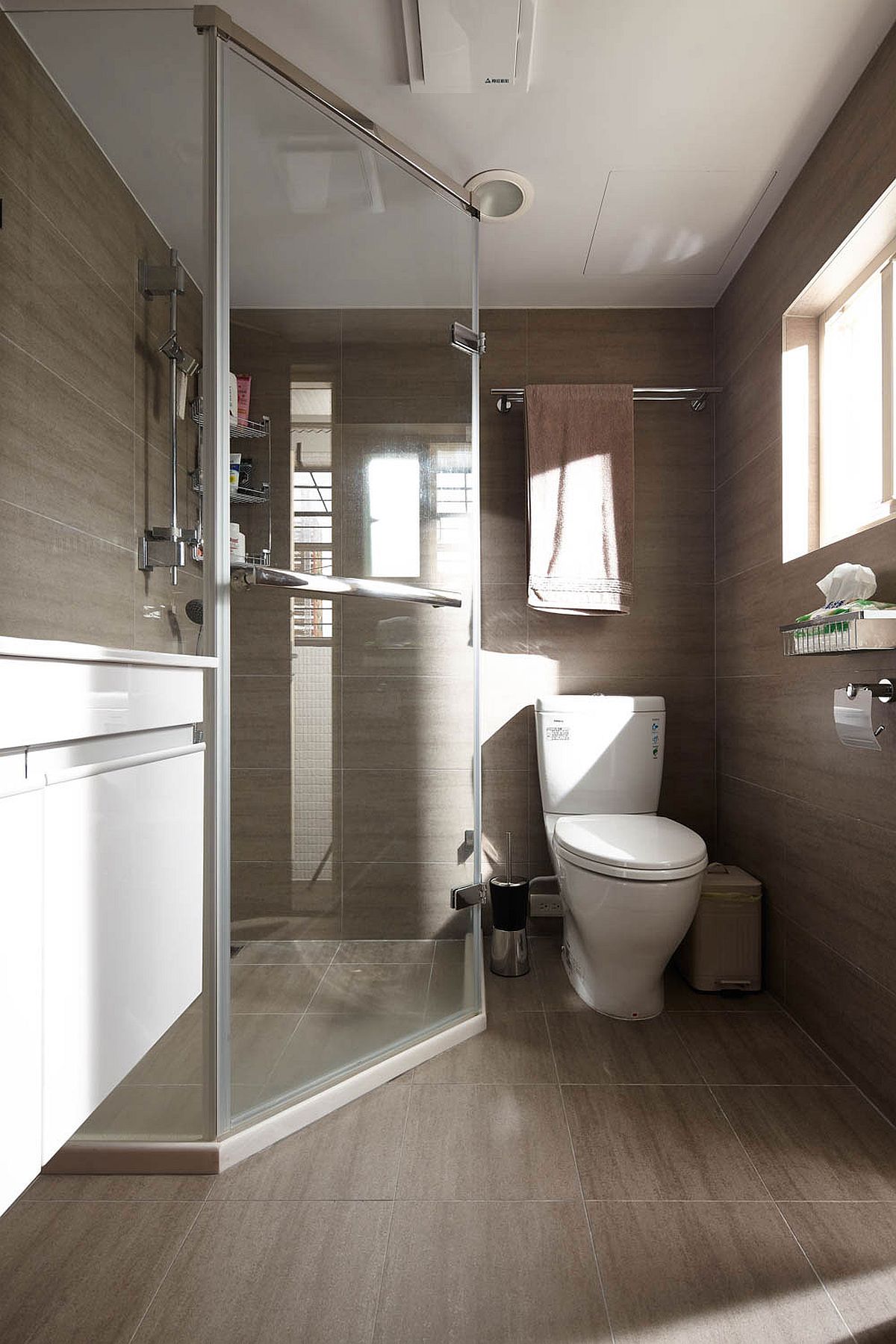 Glass door for the tiny shower area in the bathroom