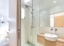 Glass-shower-area-of-the-tiny-bathroom-inside-apartment-in-Paris-217x155