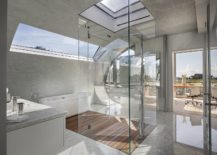 Lovely-bathroom-in-white-with-an-all-glass-shower-area-and-skylight-217x155