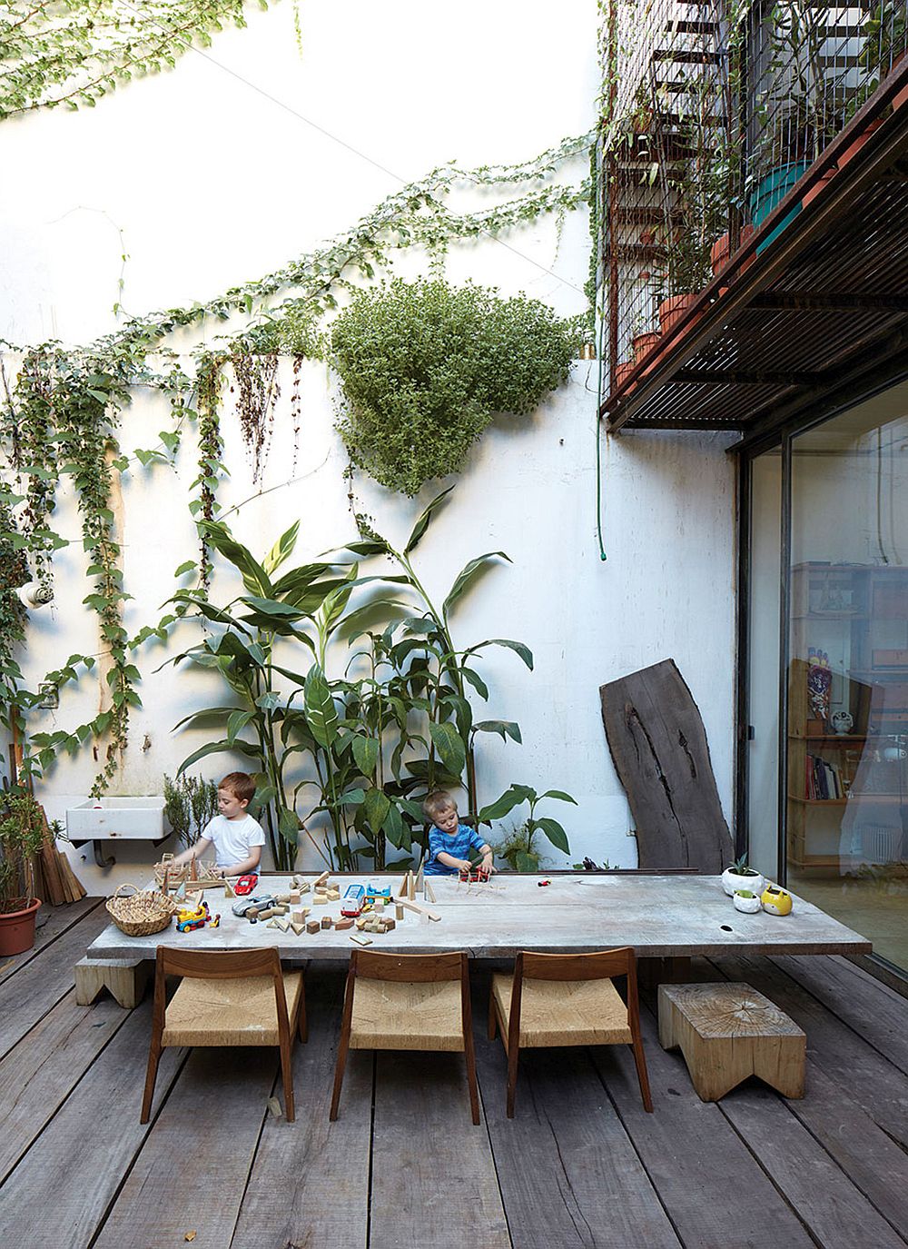 Outdoor dining area surrounded by greenery