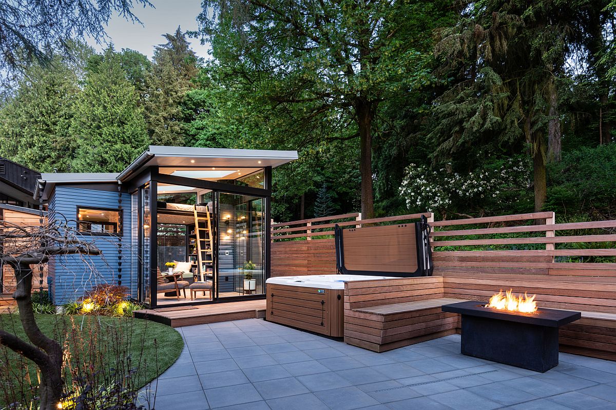 Relaxing backyard oasis with hot tub, firepit and a shower area