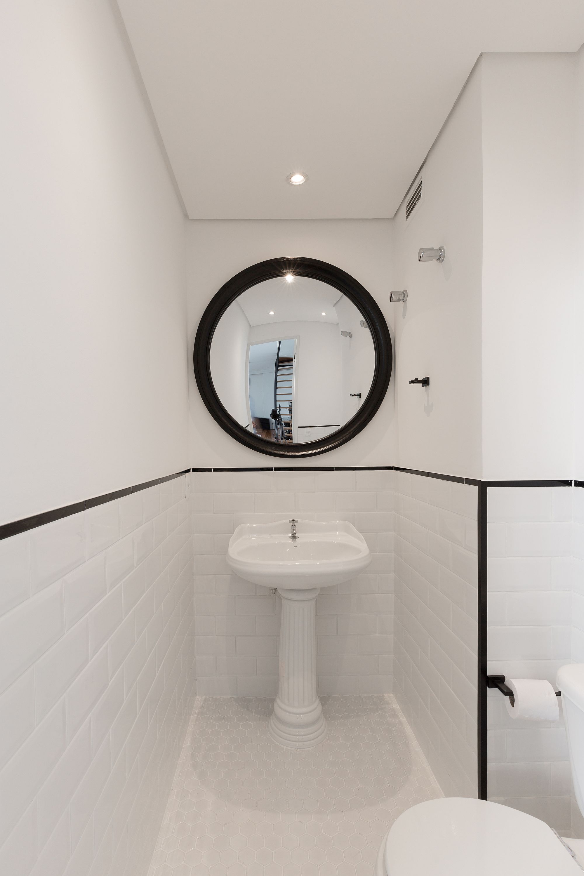 Revamped tiny toilet in white with a dash of black