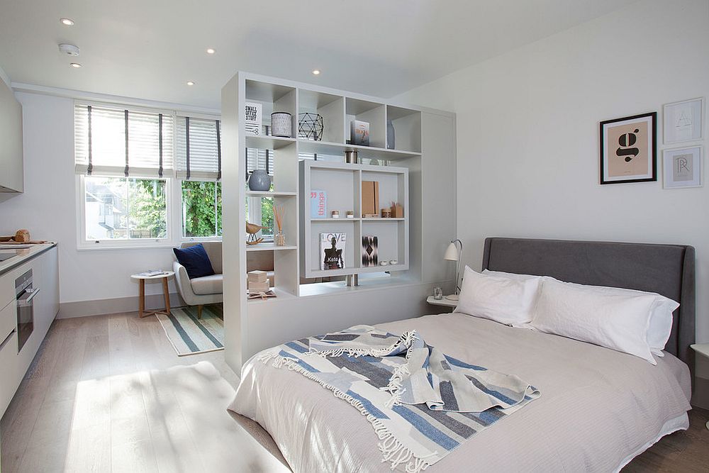 Scandinavian style bedroom with a room divider that doubles as a cool display