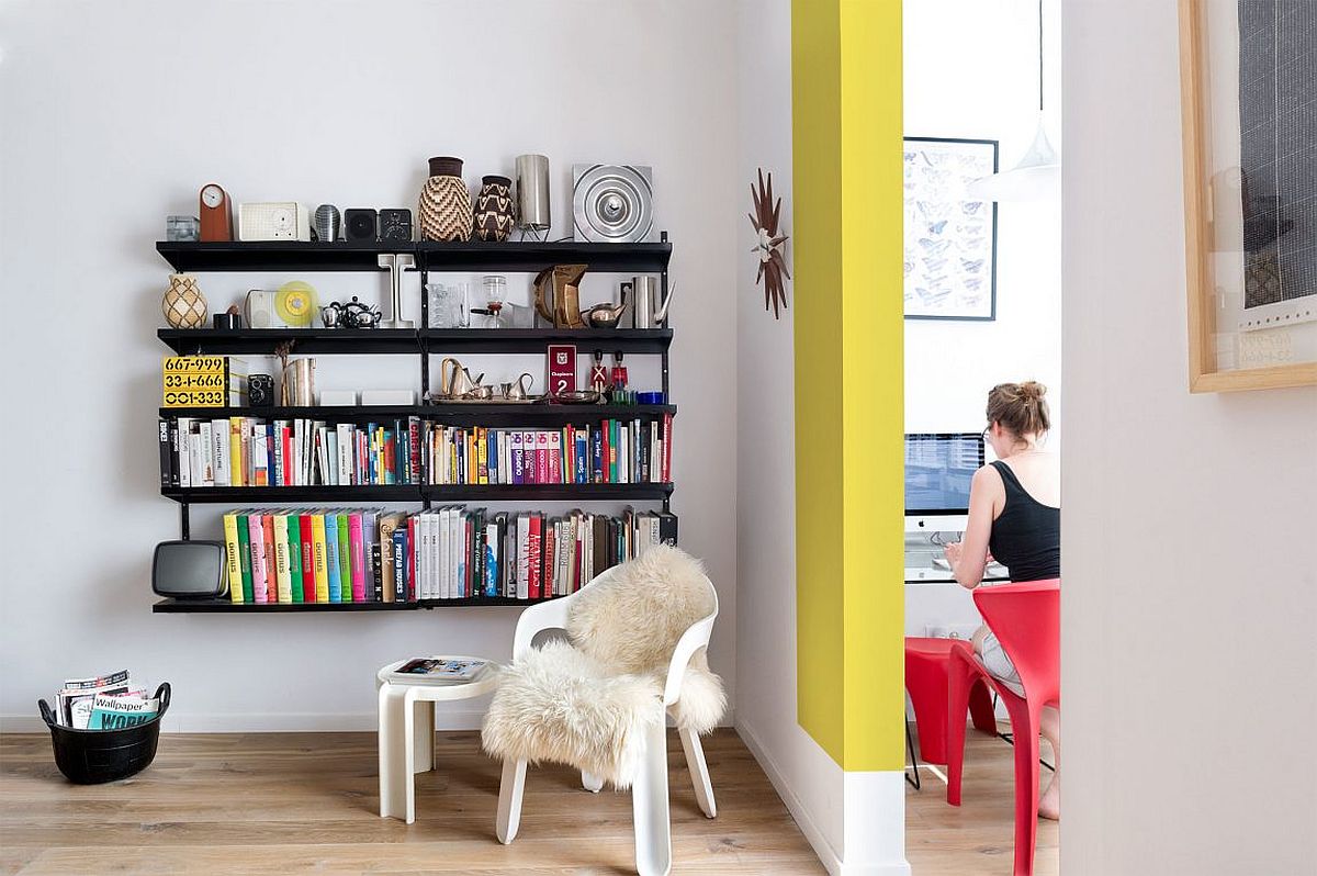 Slim-black-bookshelf-in-the-corner-is-a-smart-space-saver