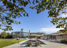 Spacious-outdoor-deck-and-pool-area-at-the-Hamptons-Residence-217x155