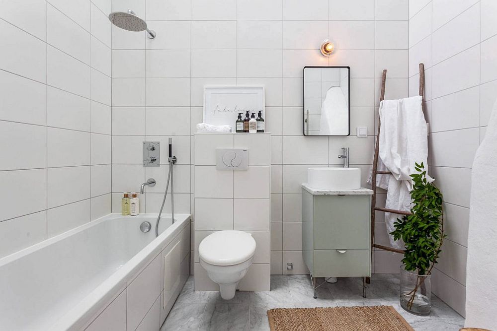 Tiny bathroom of the small attic apartment with Scandinavian style