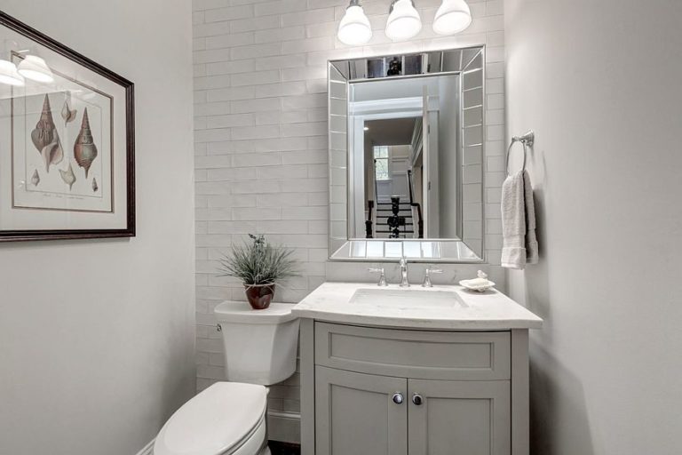 Refined And Refreshing Trendy Powder Rooms In Gray And Turquoise Decoist   White And Light Gray Powder Room With Ample Natural Light 768x512 