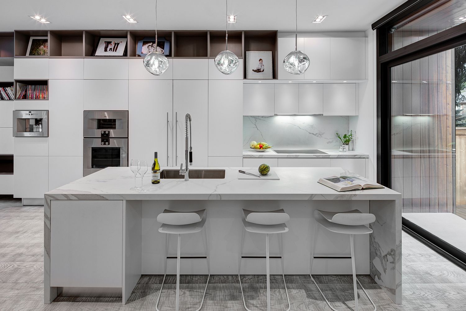 All-white kitchen of the house with a stunning central island