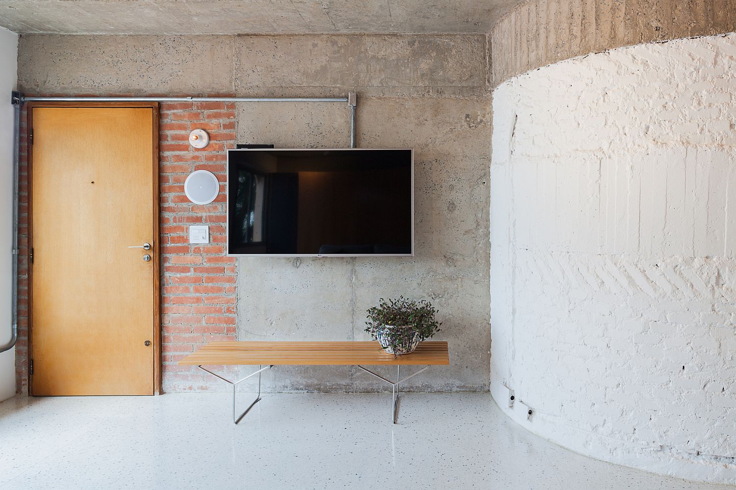 Brick-concrete-and-polished-modern-finishes-combine-inside-the-Sao-Paulo-apartment