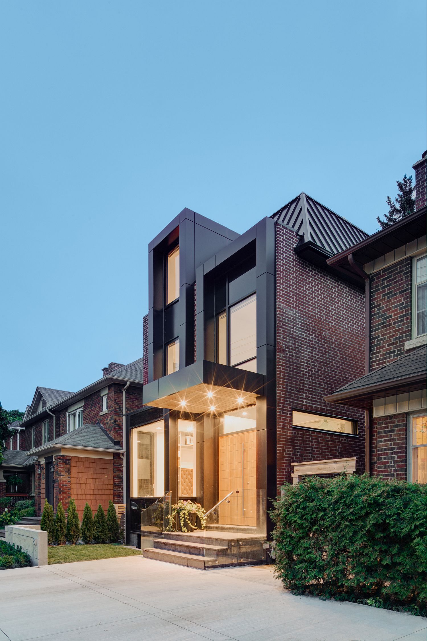 Dark metallic window and door frames give the exterior a unique look