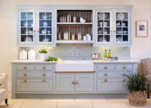 French-farmhouse-kitchen-with-a-gorgeous-plate-rack-at-the-heart-of-its-shelving-217x155