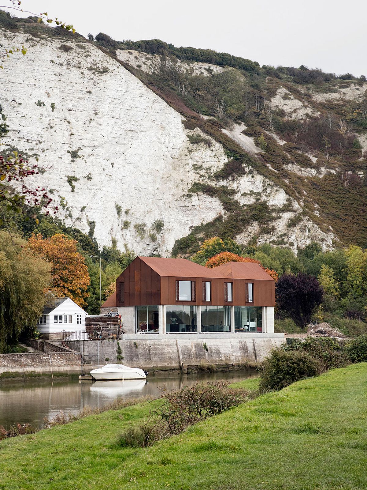 Gorgeous Cor-ten steel and concrete riverside home