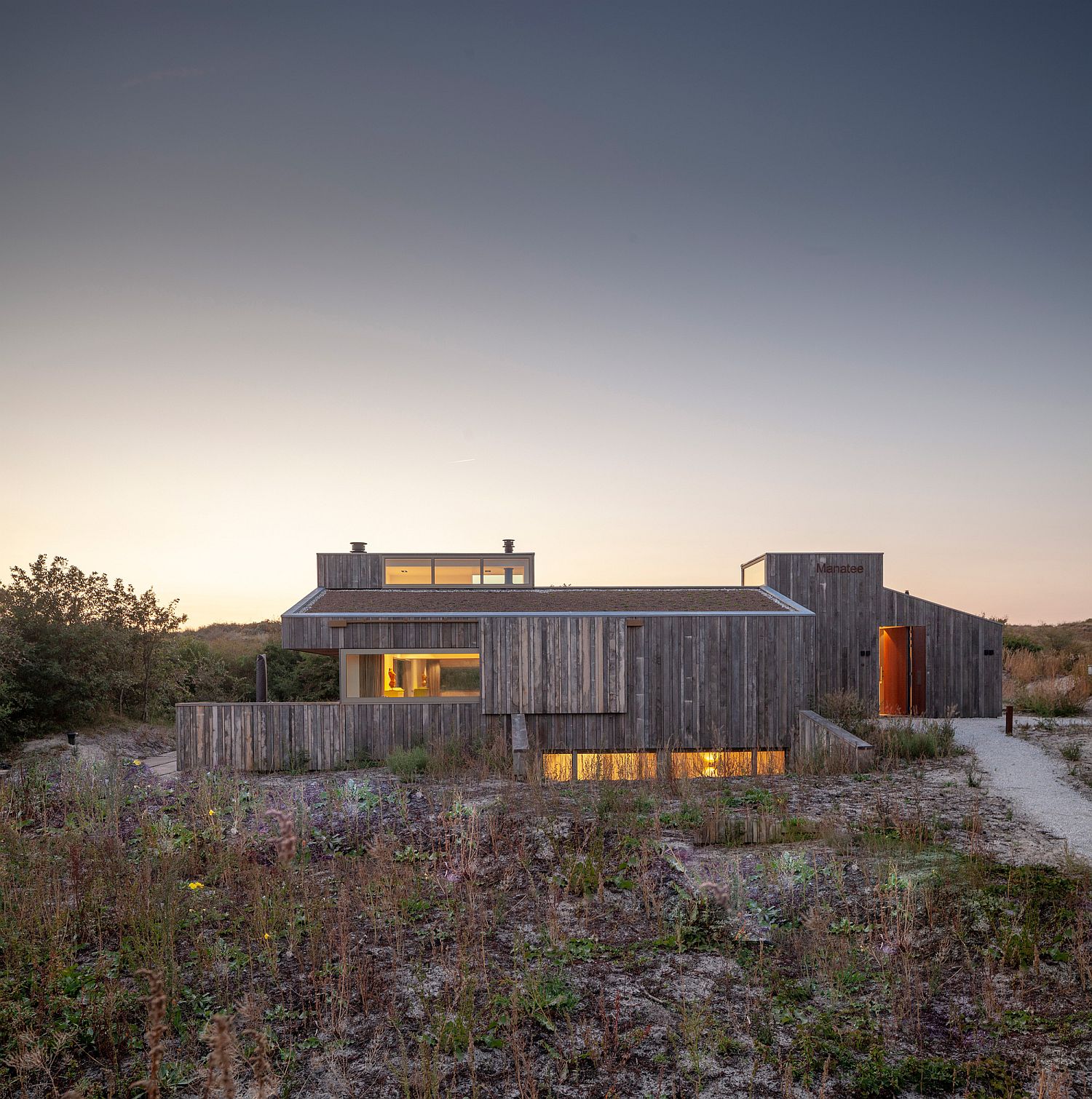 Gorgeous Dutch home with green roof and finely sawed oak exterior