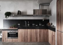 L-shaped-kitchen-in-the-corner-with-dark-countertops-and-wooden-cabinets-217x155