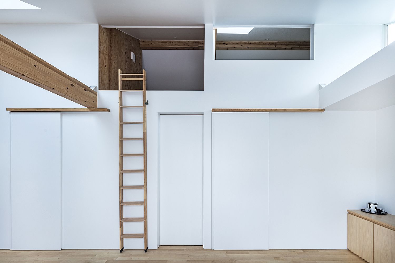 Ladder leading to the loft level inside the Japanese home