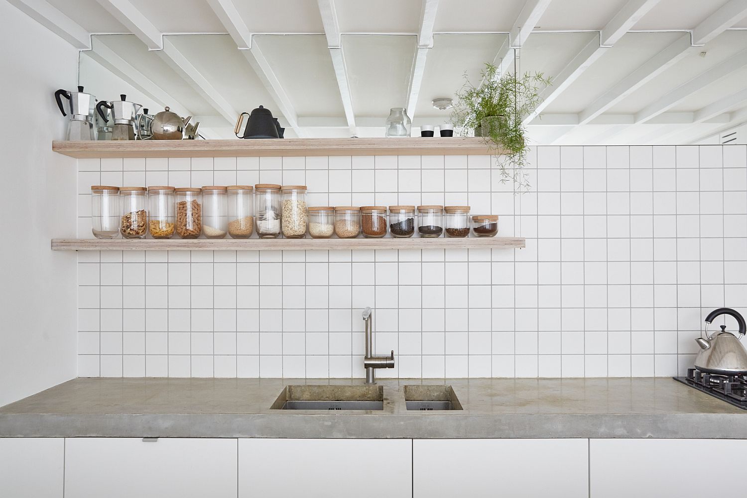 Lovely kitchen in white with subway tiles and open wooden shelves