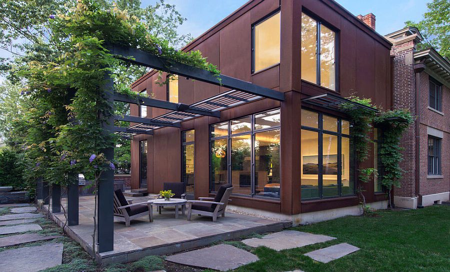 Modern extension of Georgian home clad in cor-ten steel