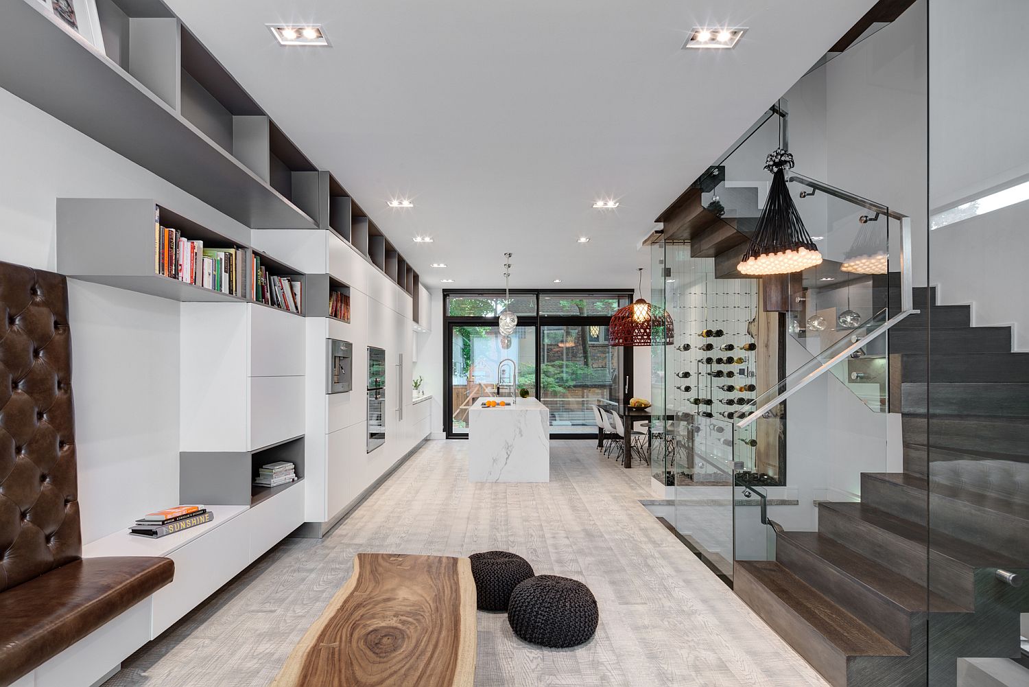 Open plan living area of the modern Toronto home in white