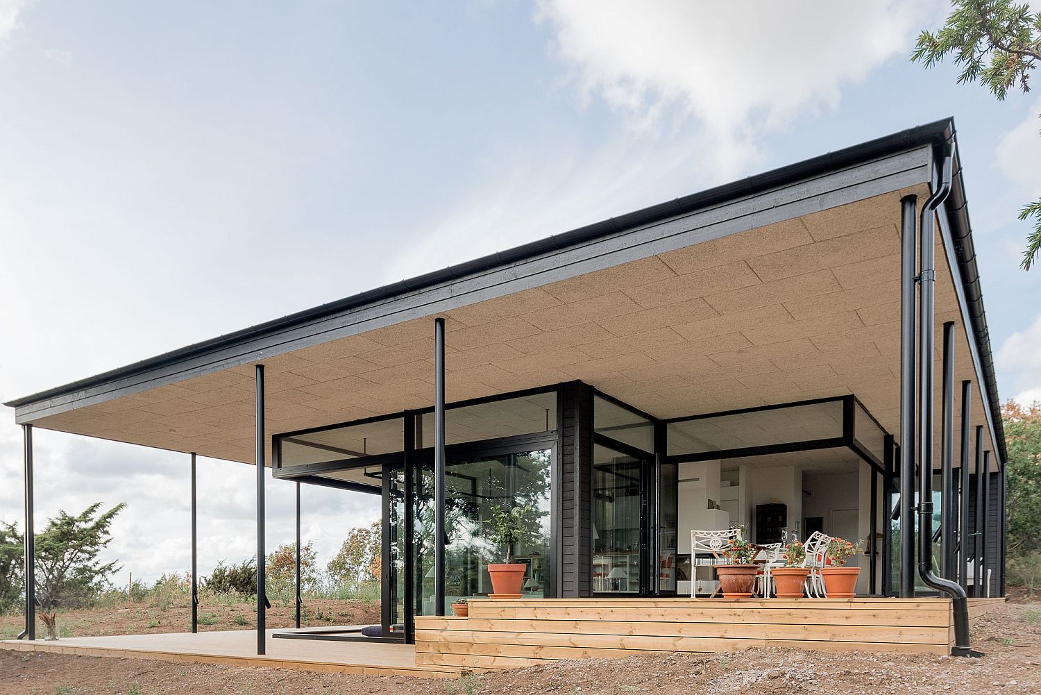 Structure of the roof provides protection from the elements as the homeowners enjoy the outdoors