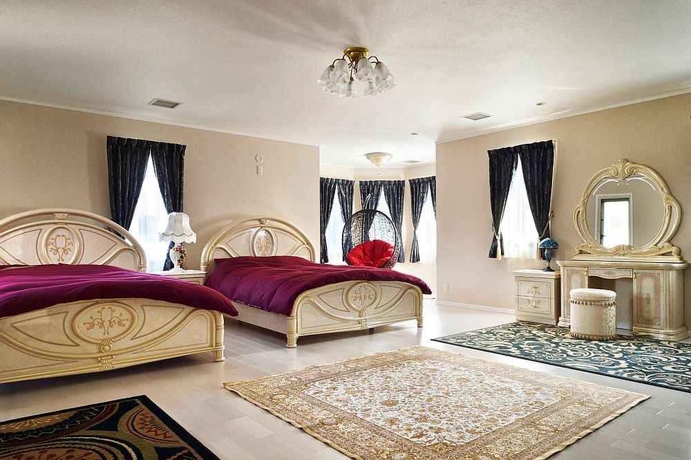 Victorian style bedroom with beige walls, purple bedding and black drapes