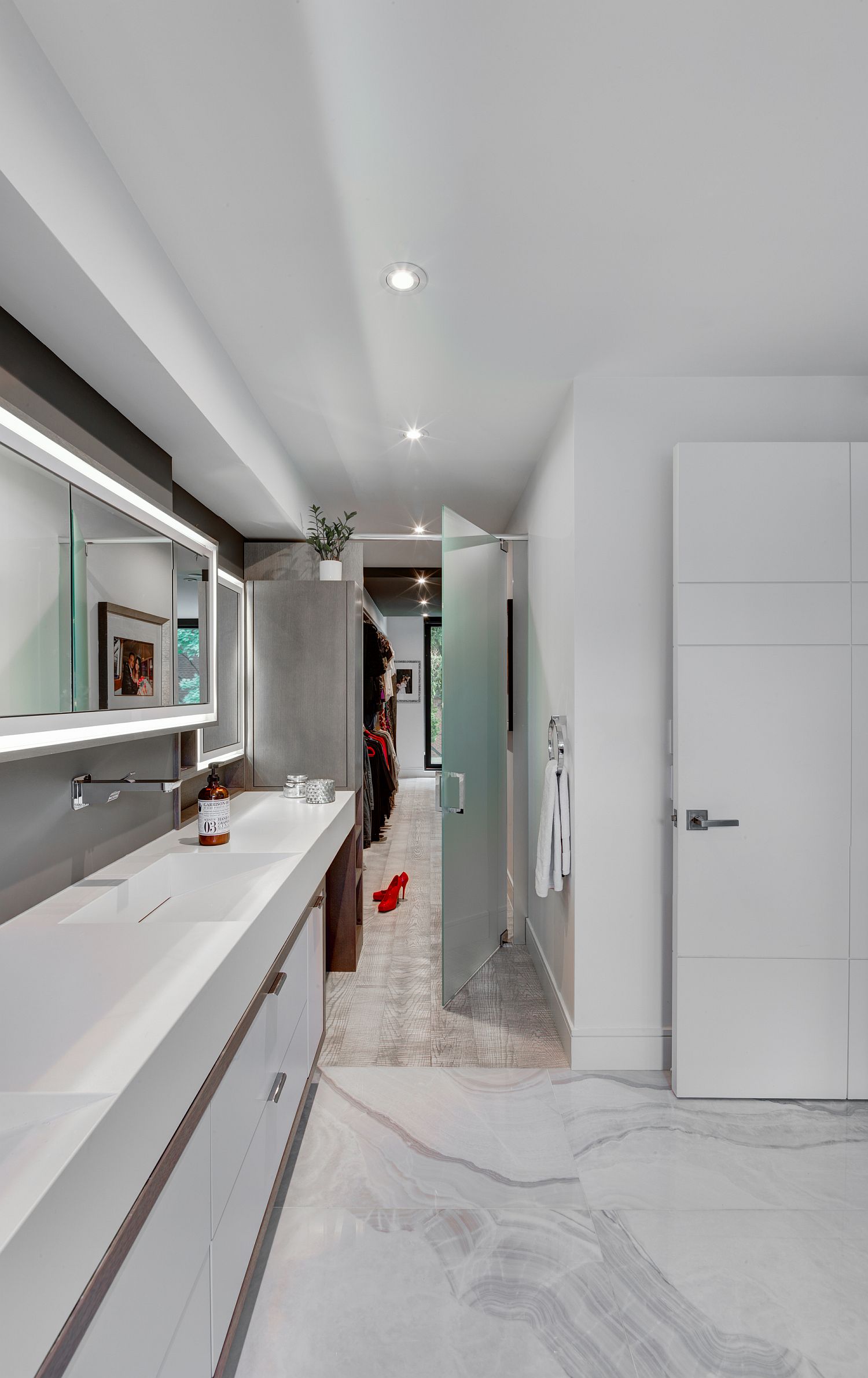 White modern bathroom with polished stone surfaces