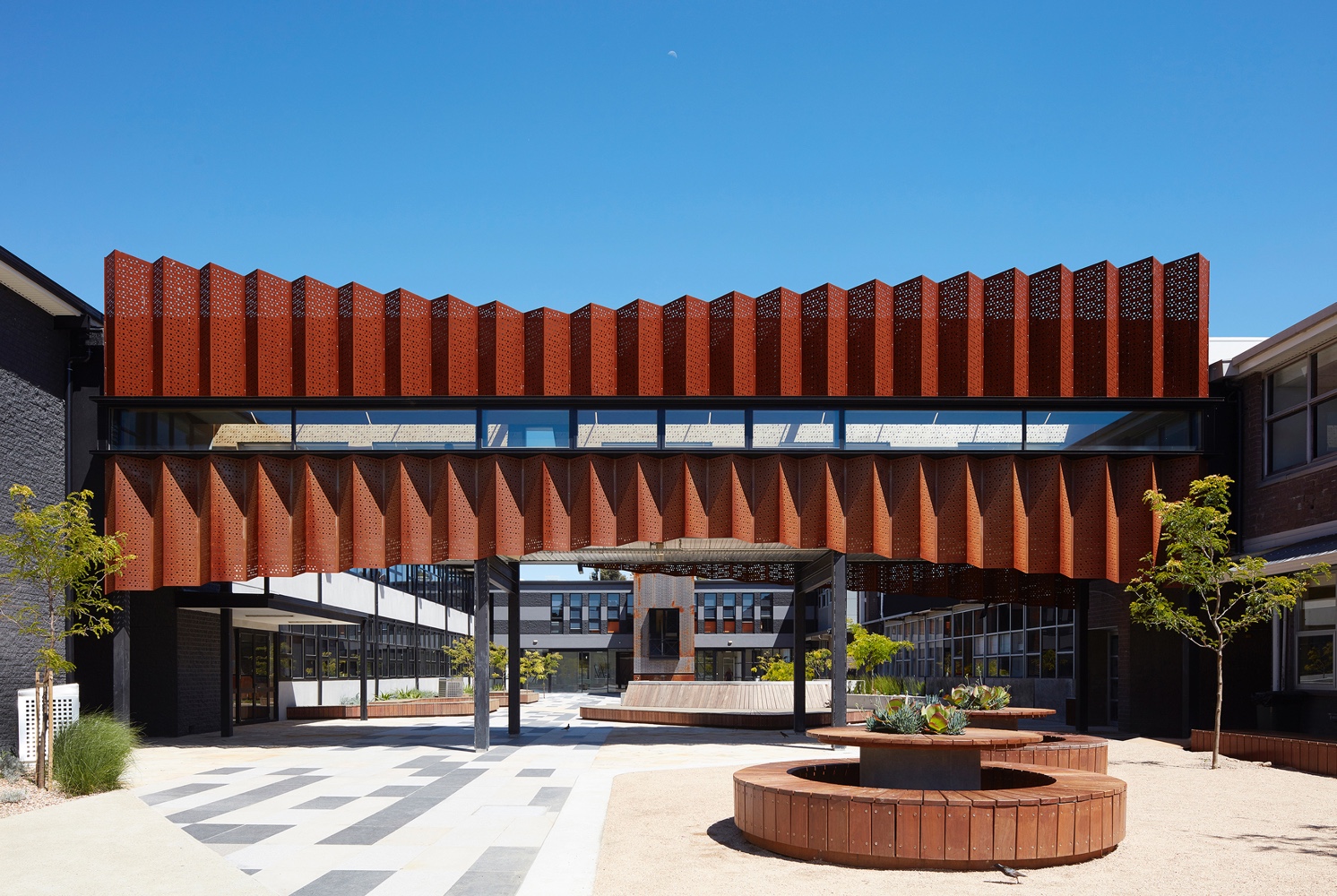 Zig-zag-corten-panels-for-the-exterior-of-Flyover-Gallery-at-Caroline-Chisholm-College