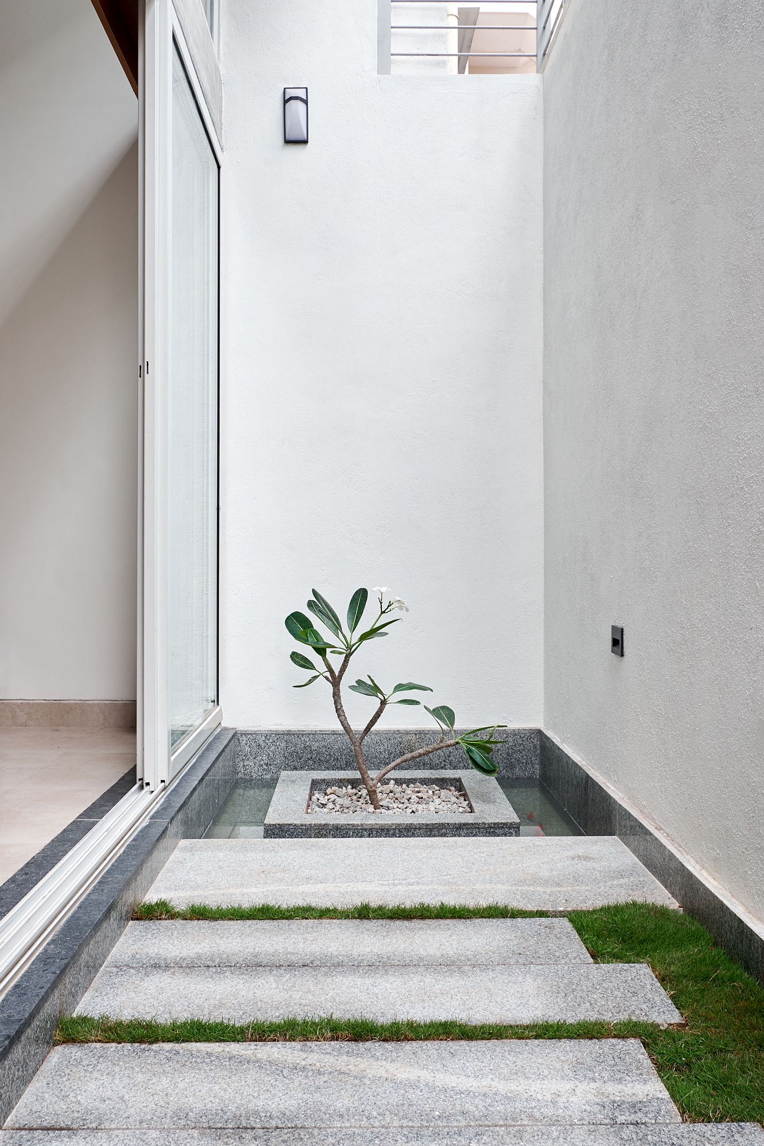 A flood of natural light illuminates the central area of the modern home