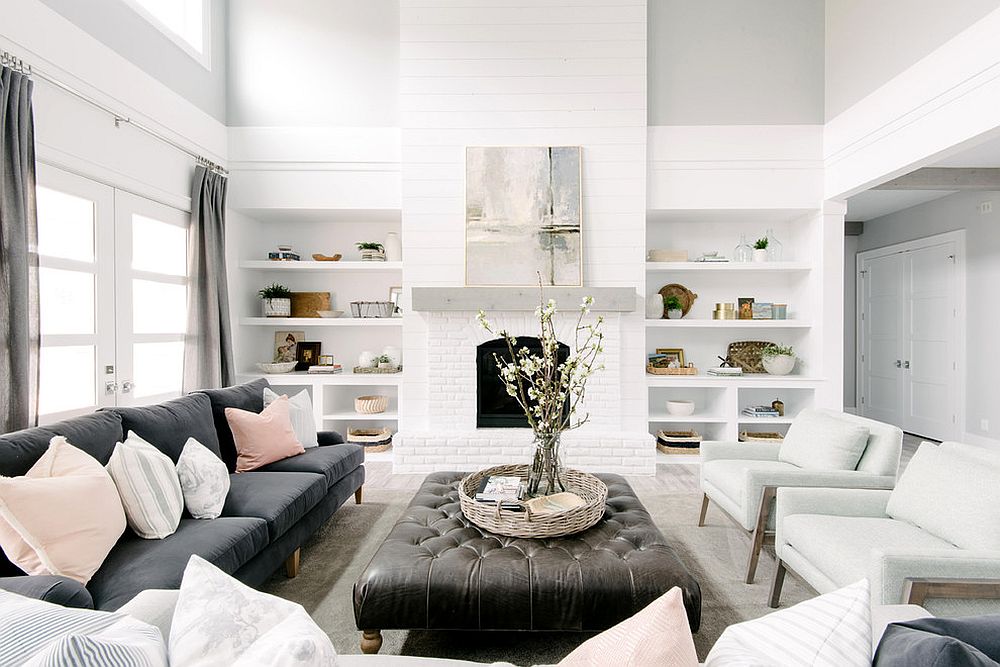 All-white living room with shelves that blend into the backdrop