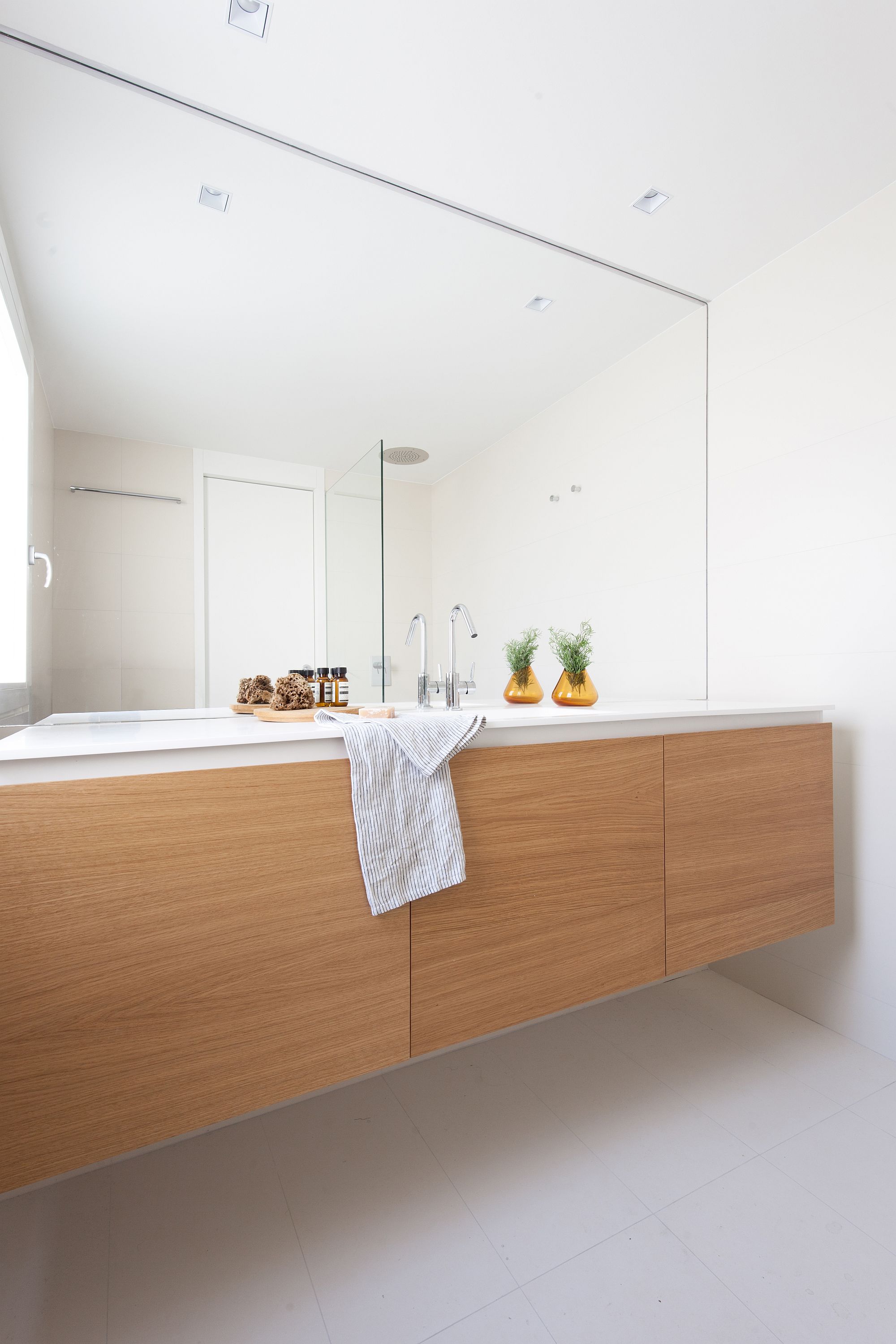 Bathroom in white with floating wooden vanity