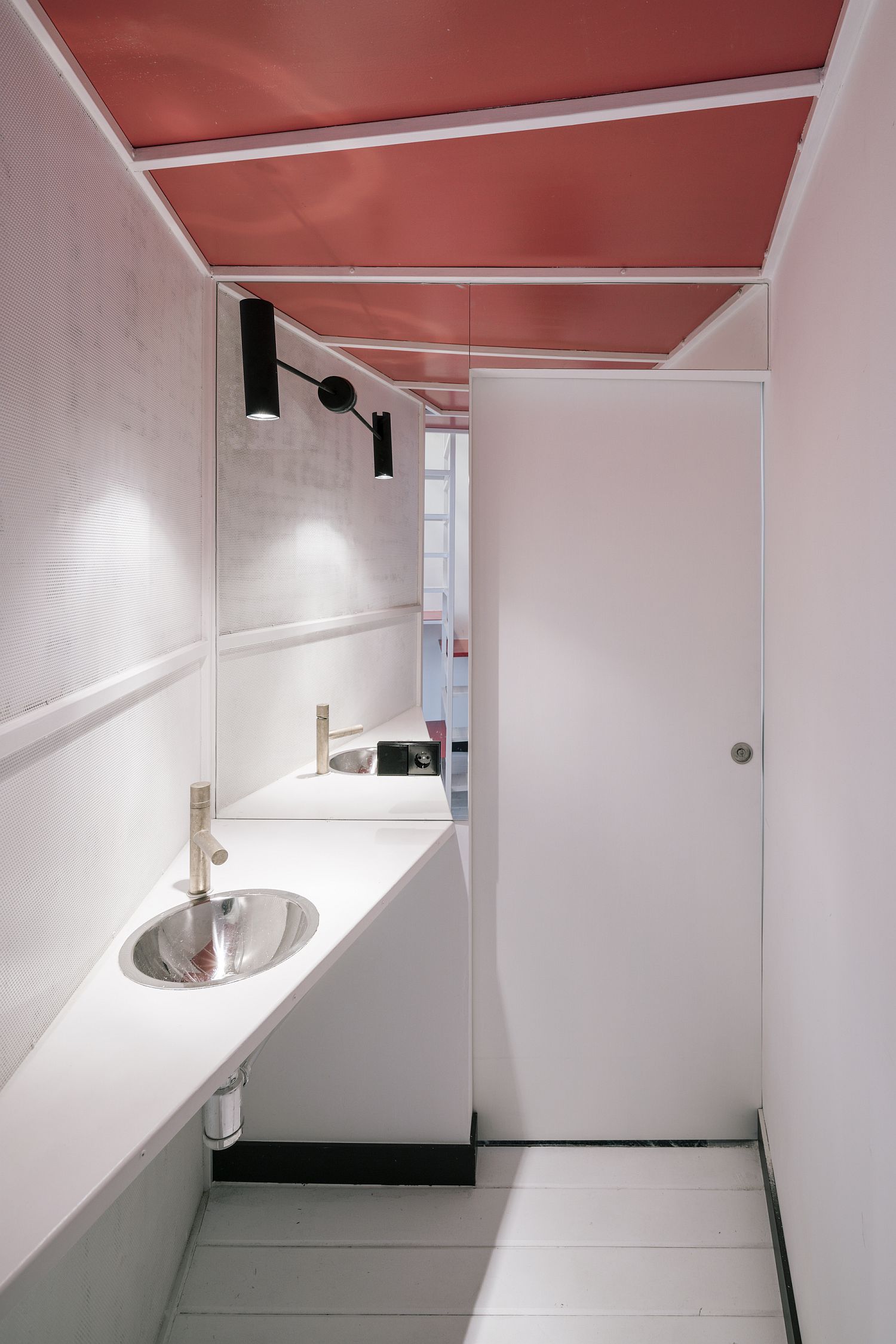 Bathroom with sliding door and a pink ceiling