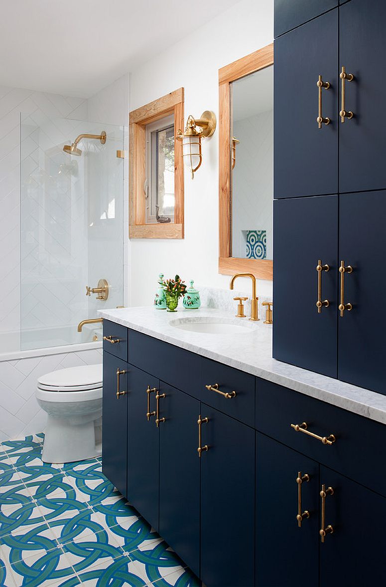 Beautiful Navy blue vanity and cabinets with brass handles for the bathroom