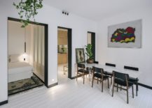 Bedroom-with-folding-doors-and-dining-area-in-white-217x155