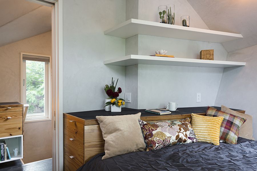 Bedroom with slim shelving and angled walls