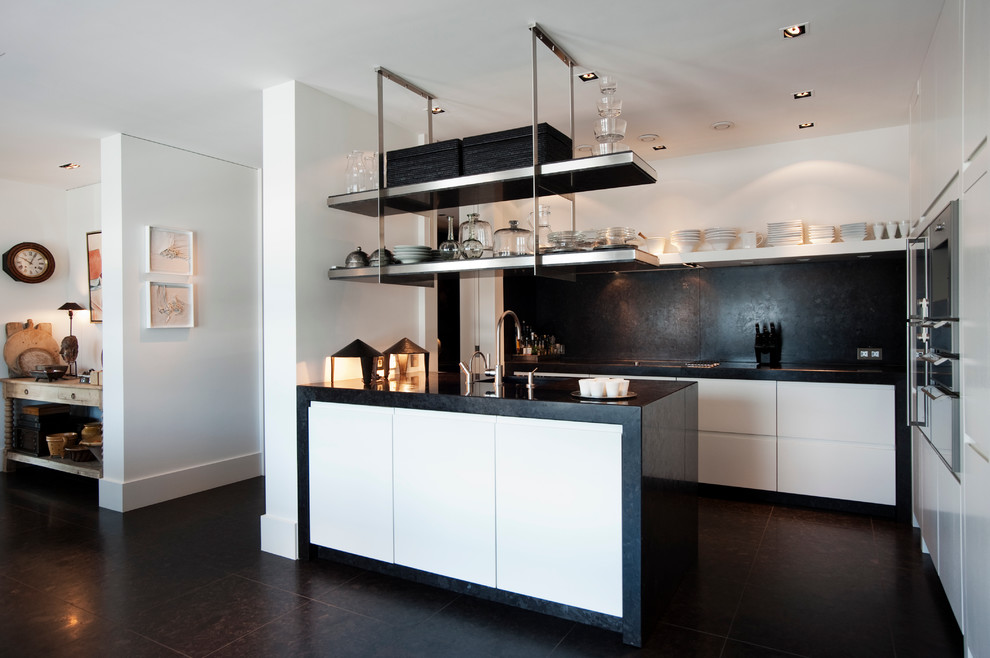 Black-backsplash-can-anchor-the-kitchen-in-white-beautifully