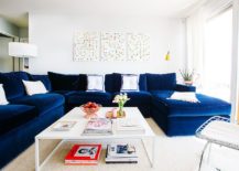 Chic-living-room-in-white-with-bright-navy-blue-sectional-217x155