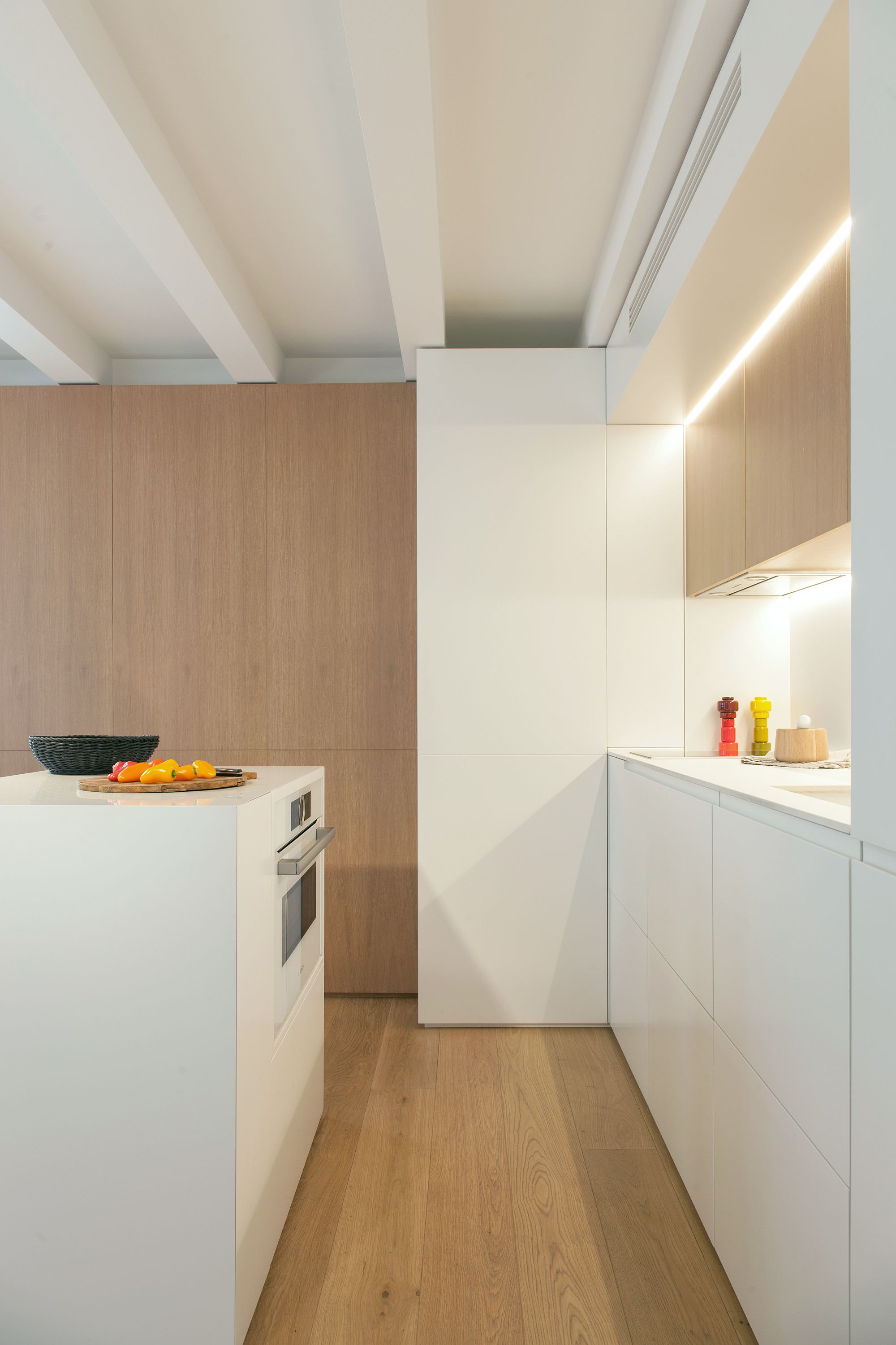 Cleverly hidden shelves, cabinets and folding furniture pieces transform this Barcelona apartment