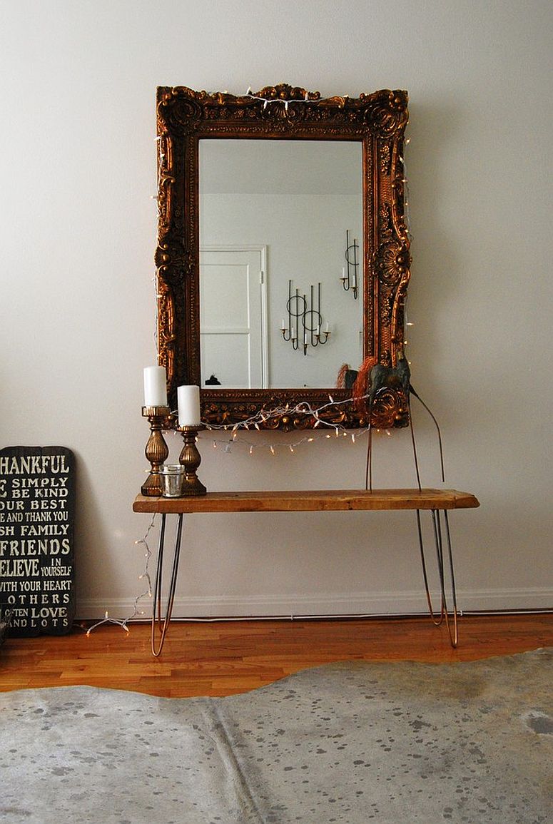 Creating a lovely focal point in the eclectic bedroom with mirror and string lights