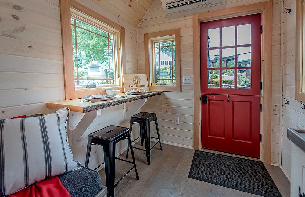 Dining and desk area rolled into one inside the tiny house