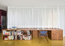 Drapes-hide-the-bespoke-wooden-structure-that-contains-the-bedroom-bathroom-and-more-217x155