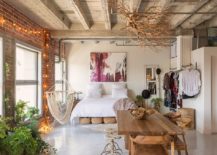 Eclectic-chic-bedroom-with-brick-wall-exposed-concrete-ceiling-and-string-lighting-217x155