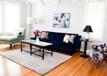 Eclectic-living-room-with-ample-natural-light-and-a-bright-navy-blue-sofa-217x155