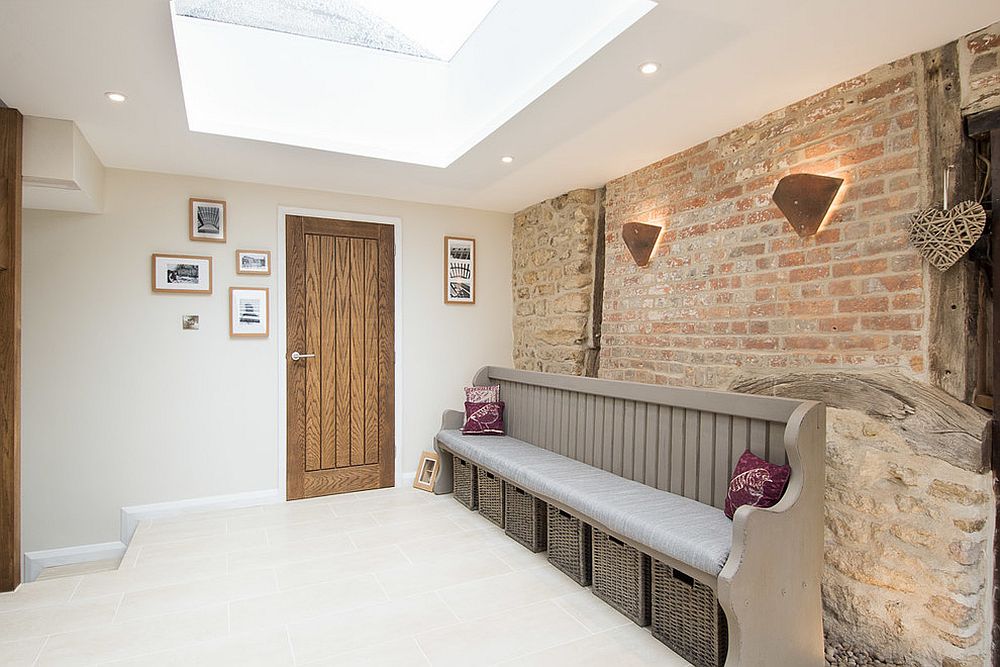 Exquisite entry with brick wall backdrop and a skylight